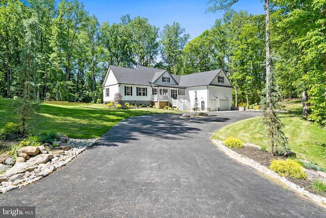 5570 Warren Dr, Huntingtown, MD 20639 - view of front of home featuring asphalt driveway, a front yard, and a garage