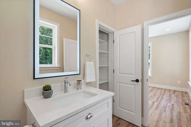 5570 Warren Dr, Huntingtown, MD 20639 - bathroom featuring vanity and wood finished floors