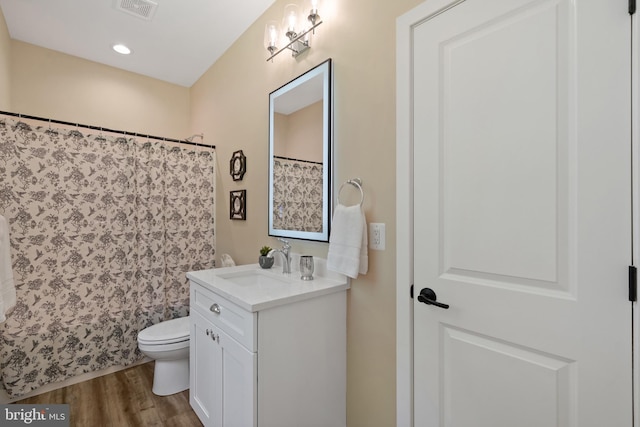 5570 Warren Dr, Huntingtown, MD 20639 - full bathroom with vanity, toilet, wood finished floors, curtained shower, and recessed lighting