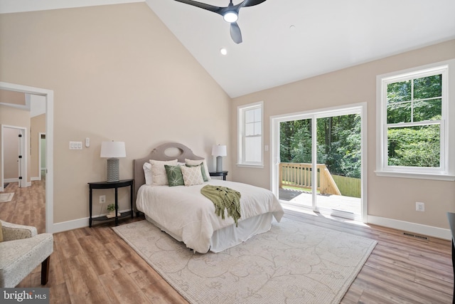 5570 Warren Dr, Huntingtown, MD 20639 - bedroom with access to exterior, high vaulted ceiling, baseboards, light wood-style flooring, and ceiling fan