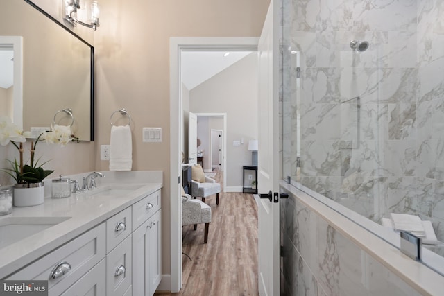 5570 Warren Dr, Huntingtown, MD 20639 - full bathroom with double vanity, wood finished floors, ensuite bathroom, and tiled shower
