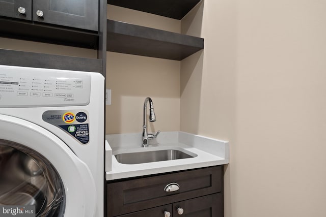 5570 Warren Dr, Huntingtown, MD 20639 - laundry area with washer / dryer and cabinet space