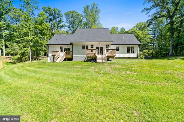 5570 Warren Dr, Huntingtown, MD 20639 - rear view of property with a lawn, a deck, stairs, and a shingled roof