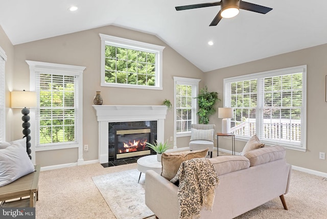 8002 Gosport Ln, Springfield, VA 22151 - carpeted living area with vaulted ceiling, ceiling fan, a premium fireplace, healthy amount of natural light, and baseboards