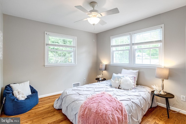 8002 Gosport Ln, Springfield, VA 22151 - bedroom featuring wood finished floors, baseboards, and a ceiling fan