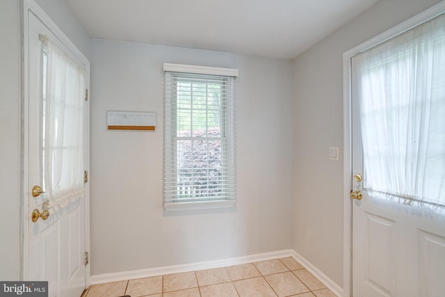 8002 Gosport Ln, Springfield, VA 22151 - doorway with light tile patterned floors and baseboards