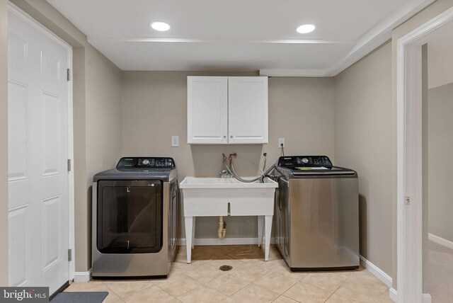 8002 Gosport Ln, Springfield, VA 22151 - washroom featuring cabinet space, separate washer and dryer, baseboards, light tile patterned floors, and recessed lighting