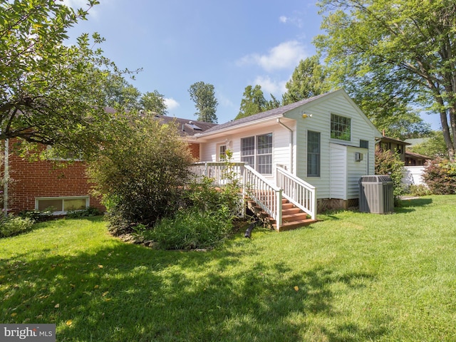 8002 Gosport Ln, Springfield, VA 22151 - back of property featuring central air condition unit, a lawn, and a wooden deck
