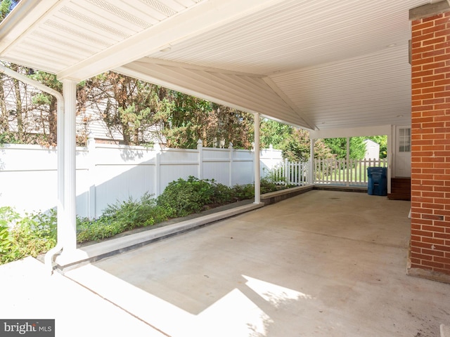 8002 Gosport Ln, Springfield, VA 22151 - view of patio featuring fence and a carport