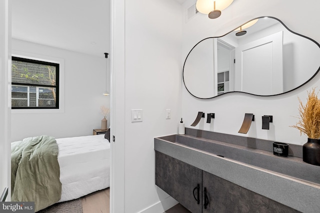 2035 Pierce St, Philadelphia, PA 19145 - bathroom featuring vanity, baseboards, and wood finished floors