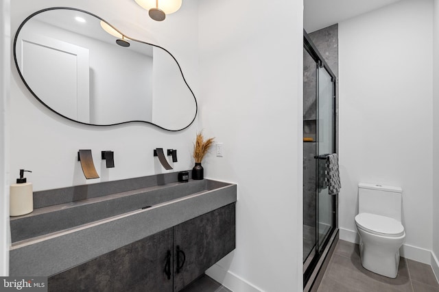 2035 Pierce St, Philadelphia, PA 19145 - full bathroom featuring toilet, baseboards, a stall shower, vanity, and tile patterned floors