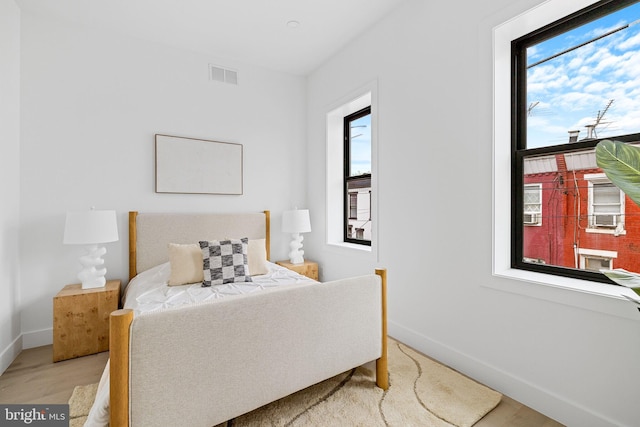 2035 Pierce St, Philadelphia, PA 19145 - bedroom with multiple windows, baseboards, and light wood-style flooring