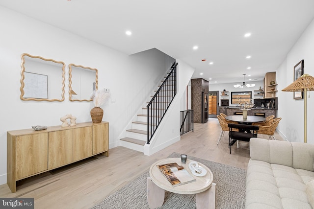 2035 Pierce St, Philadelphia, PA 19145 - living room with stairs, light wood finished floors, recessed lighting, baseboards, and a chandelier