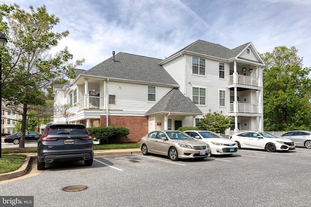 9663 Devedente Dr Unit 101, Owings Mills, MD 21117 - view of property featuring uncovered parking