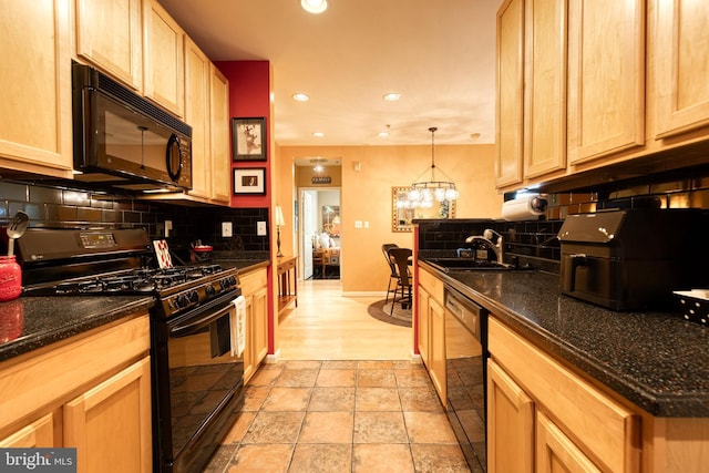9663 Devedente Dr Unit 101, Owings Mills, MD 21117 - kitchen featuring black appliances, tasteful backsplash, a sink, recessed lighting, and baseboards