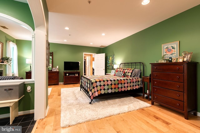 9663 Devedente Dr Unit 101, Owings Mills, MD 21117 - bedroom with wood finished floors, recessed lighting, arched walkways, and baseboards