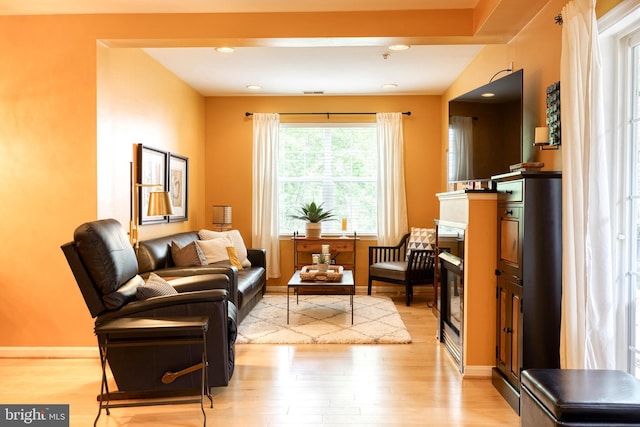 9663 Devedente Dr Unit 101, Owings Mills, MD 21117 - living area featuring light wood-type flooring and baseboards