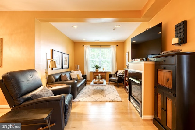 9663 Devedente Dr Unit 101, Owings Mills, MD 21117 - living room featuring light wood-type flooring, a glass covered fireplace, and recessed lighting