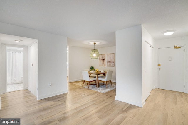 1300 Army Navy Dr Unit 124, Arlington, VA 22202 - foyer featuring light wood finished floors and baseboards
