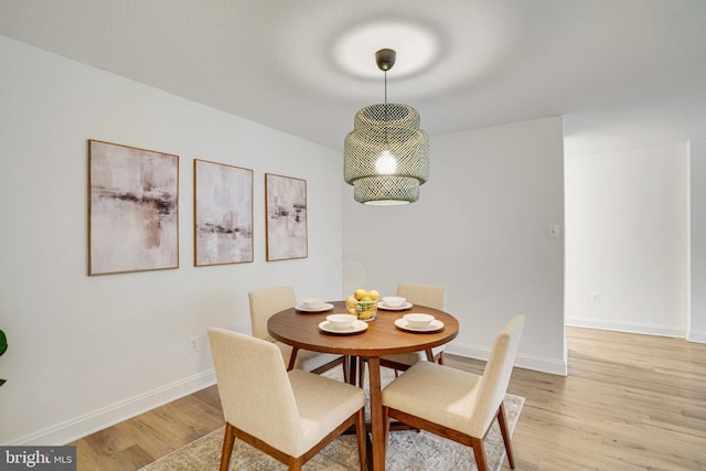 1300 Army Navy Dr Unit 124, Arlington, VA 22202 - dining space with light wood finished floors and baseboards