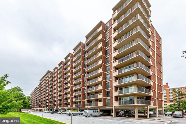 1300 Army Navy Dr Unit 124, Arlington, VA 22202 - view of property with covered and uncovered parking