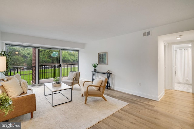 1300 Army Navy Dr Unit 124, Arlington, VA 22202 - living area with wood finished floors and baseboards