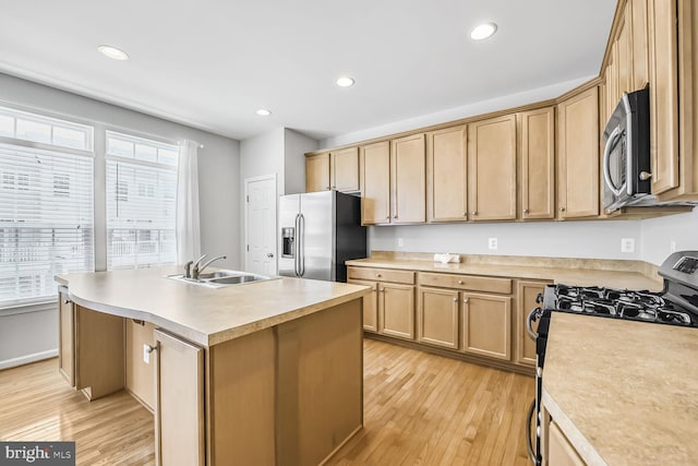 42952 Miltec Ter, Chantilly, VA 20152 - kitchen with stainless steel appliances, light wood-type flooring, a kitchen island with sink, light countertops, and recessed lighting