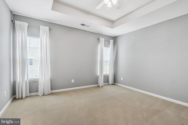 42952 Miltec Ter, Chantilly, VA 20152 - spare room featuring light colored carpet, a ceiling fan, baseboards, and a raised ceiling