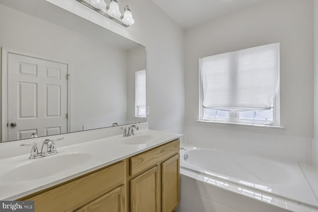 42952 Miltec Ter, Chantilly, VA 20152 - bathroom with a garden tub and double vanity