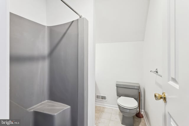 339 Gray Dr, Lusby, MD 20657 - bathroom featuring a shower, toilet, baseboards, and tile patterned flooring