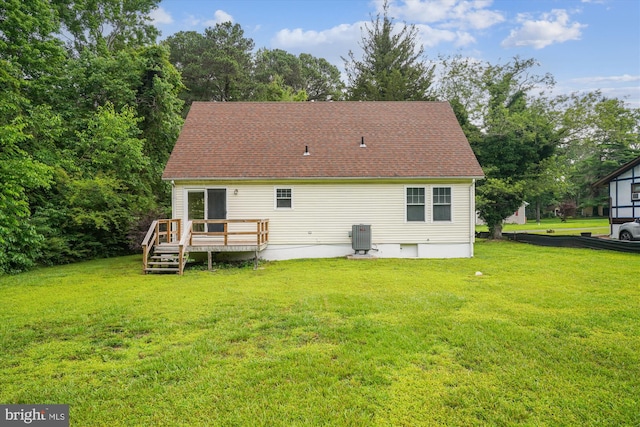 339 Gray Dr, Lusby, MD 20657 - rear view of property with a deck, a yard, central AC unit, and roof with shingles