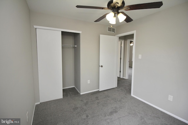 unfurnished bedroom with carpet, a closet, baseboards, and ceiling fan