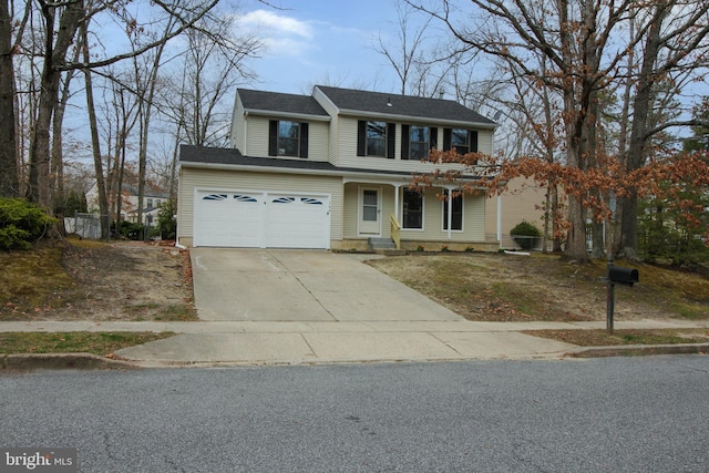 traditional-style home with concrete driveway, an attached garage, and a porch