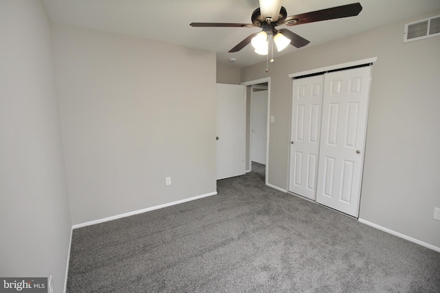 unfurnished bedroom with carpet, a closet, baseboards, and ceiling fan