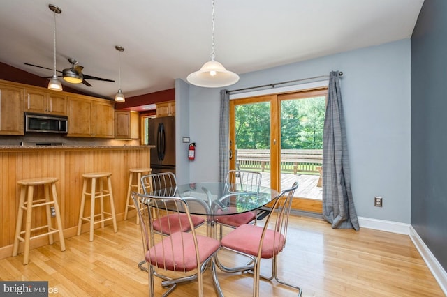 30 Brooktree Rd, East Windsor, NJ 08520 - dining area featuring light wood-style flooring, a ceiling fan, and baseboards