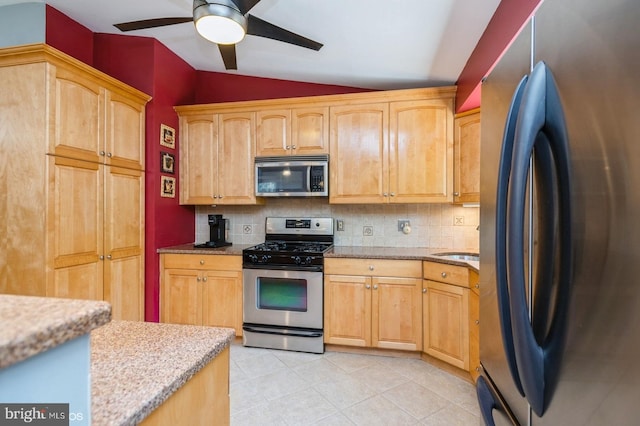 30 Brooktree Rd, East Windsor, NJ 08520 - kitchen with stainless steel appliances, lofted ceiling, backsplash, ceiling fan, and light stone counters