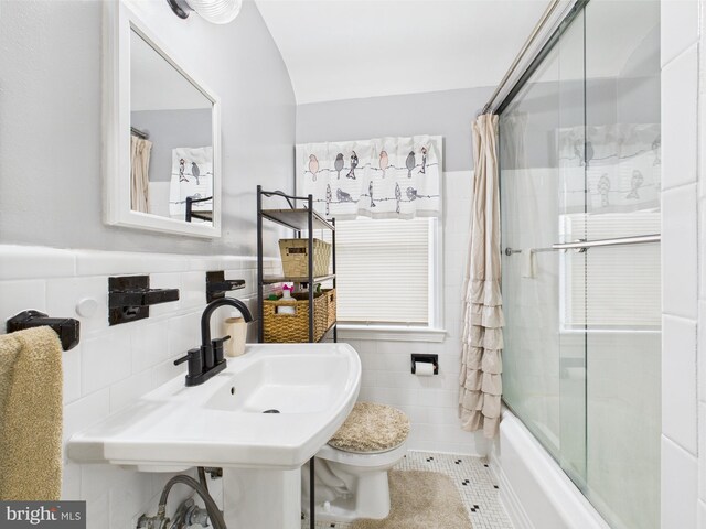 8663 Black Oak, Baltimore, MD 21234 - bathroom featuring tile walls, toilet, enclosed tub / shower combo, tile patterned floors, and a wainscoted wall