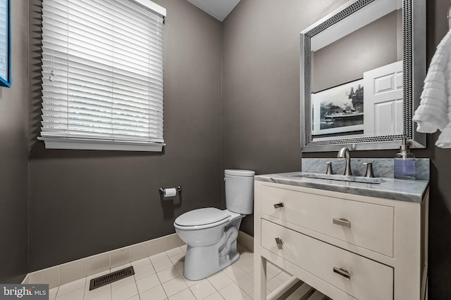 115 Hartefeld Dr, Avondale, PA 19311 - half bathroom with toilet, vanity, baseboards, and tile patterned flooring