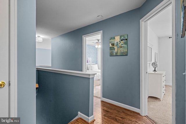 115 Hartefeld Dr, Avondale, PA 19311 - hall featuring an upstairs landing, baseboards, and wood finished floors