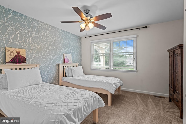 115 Hartefeld Dr, Avondale, PA 19311 - bedroom with wallpapered walls, baseboards, an accent wall, carpet flooring, and a ceiling fan