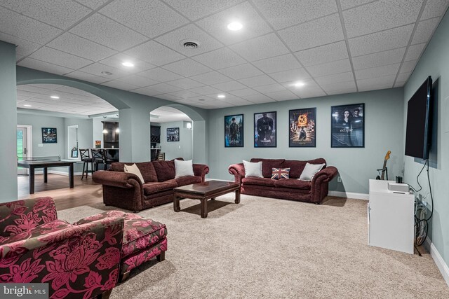 115 Hartefeld Dr, Avondale, PA 19311 - living room with arched walkways, carpet, baseboards, a paneled ceiling, and recessed lighting