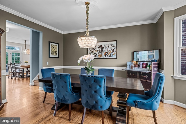 115 Hartefeld Dr, Avondale, PA 19311 - dining room with a chandelier, wood finished floors, baseboards, and crown molding