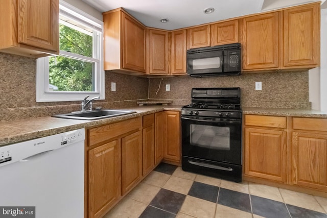 294 Jefferson St, Carneys Point, NJ 08069 - kitchen with black appliances, a sink, backsplash, and light tile patterned floors
