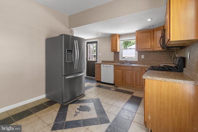 294 Jefferson St, Carneys Point, NJ 08069 - kitchen featuring stainless steel fridge, dishwasher, gas stove, a sink, and decorative backsplash