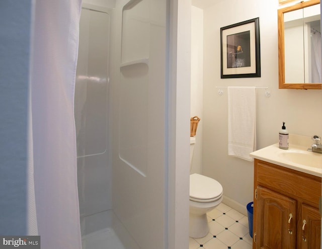 full bath with a shower with shower curtain, tile patterned floors, vanity, toilet, and baseboards