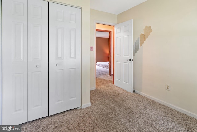 101 George St, Taneytown, MD 21787 - unfurnished bedroom with carpet flooring, baseboards, and a closet