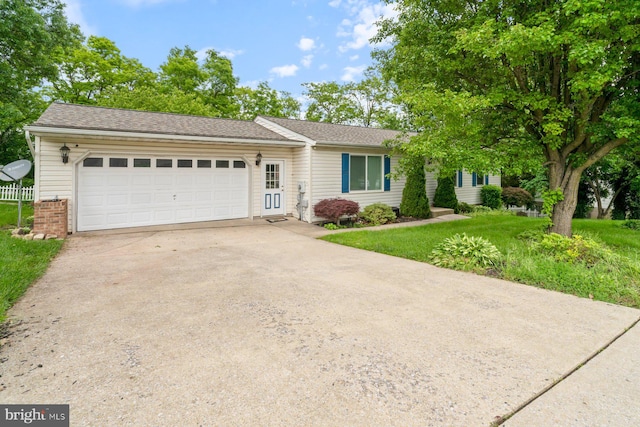 101 George St, Taneytown, MD 21787 - ranch-style home with concrete driveway, an attached garage, and a front lawn