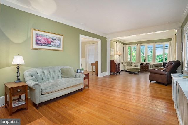 759 Avenue F, Langhorne, PA 19047 - living room featuring light wood-style floors, crown molding, decorative columns, and baseboards