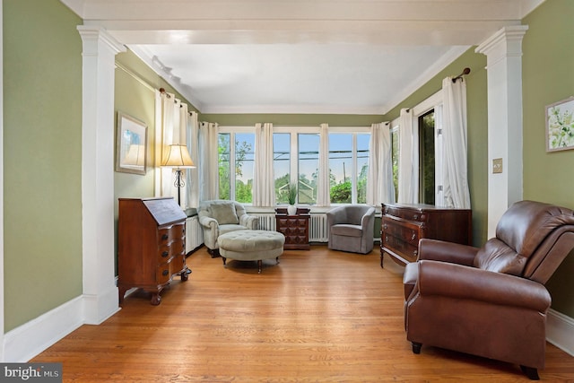 759 Avenue F, Langhorne, PA 19047 - living area with light wood-style flooring, decorative columns, radiator, and crown molding