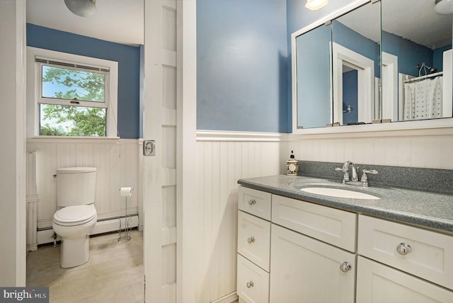 759 Avenue F, Langhorne, PA 19047 - full bath featuring a wainscoted wall, baseboard heating, vanity, toilet, and a baseboard heating unit